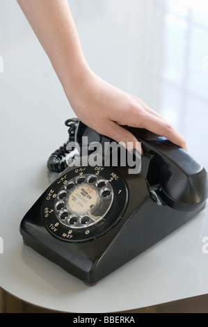 Woman's Hand on a Black Phone, Montreal, Quebec Stock Photo