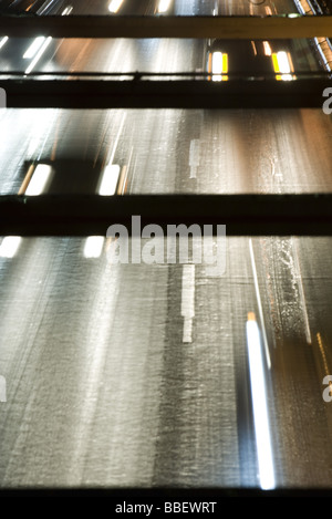 Headlights of oncoming traffic speeding along freeway, high angle view Stock Photo