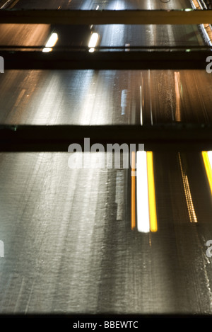 Headlights of oncoming traffic speeding along freeway, high angle view Stock Photo