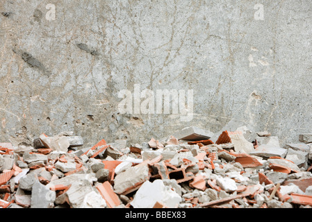 Construction rubble, broken bricks, pieces of concrete against wall Stock Photo