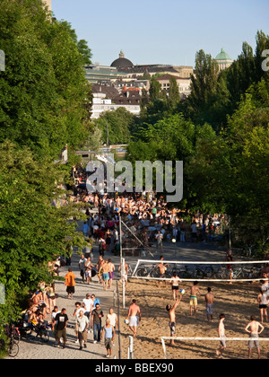 Open air bath Letten at river Limmat beach volleyball people sunbathing Zurich Switzerland Stock Photo