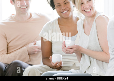 Students drinking tea after yoga class, Vancouver, British Columbia Stock Photo