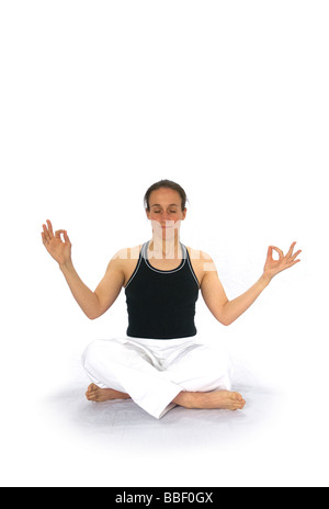 A woman wearing martial arts clothing exercising Stock Photo