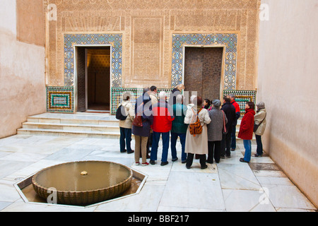 Tour Group in the Patio del Cuarto Dorado in the Alhambra in Granada Spain Stock Photo