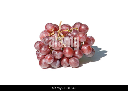 Cluster of red grapes on white background Stock Photo