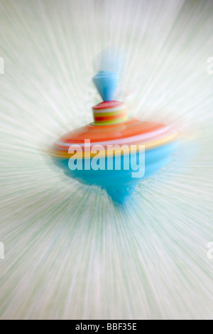 spinning top colorful toy fast moving dizzy equilibrium Stock Photo