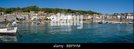 Panoramic view of Mousehole harbour as the tide comes in. Stock Photo