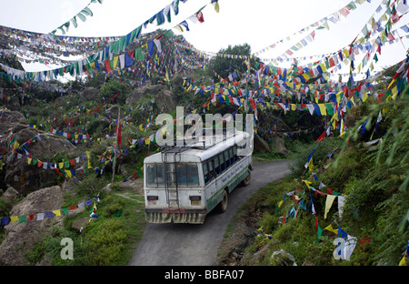 Bus and prayer flags. Rewalsar Lake. Kullu Valley. Himachal Pradesh. India Stock Photo