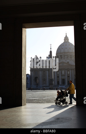 Man pushing baby in a pram at St Peter's Basilica, Vatican. Stock Photo
