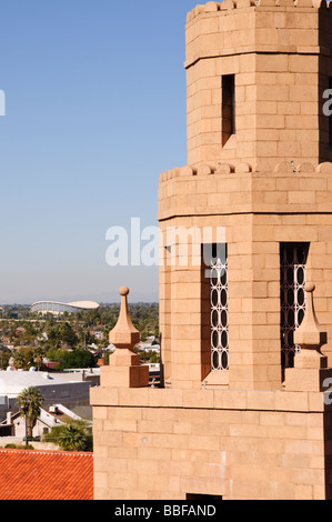 Bell tower of Historic First Presbyterian Church in Phoenix Arizona with Coliseum in distance Stock Photo