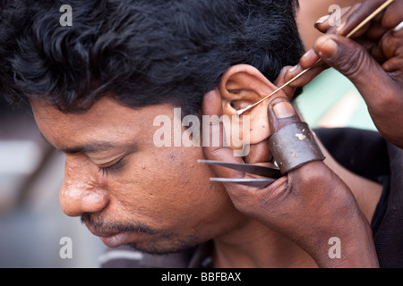 Ear Cleaning in Old Delhi India Stock Photo
