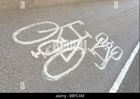 Painted sign on road indicating a cycle way Stock Photo