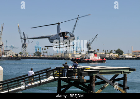 Small helicopter type Robinson R22, a two-bladed, single-engine light utility helicopter manufactured by Robinson Helicopter Stock Photo