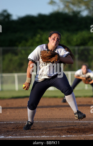 A High School pitcher winds up during a softball game in Stratford Connecticut USA Stock Photo