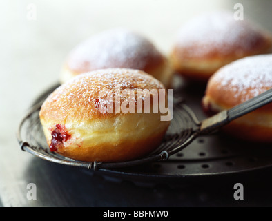 Jam filled donut dusted with powdered sugar Stock Photo