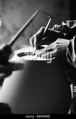 Potter's hands shaping pottery Stock Photo