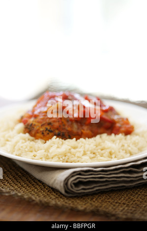 Authentic Thai Red Chicken Curry with Peppers and Boiled Fragrant Rice With No People Stock Photo