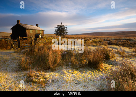 Frosty winter scene at the deserted Nuns Cross Farm on Dartmoor Devon UK Stock Photo