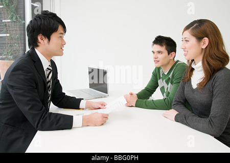 Businessman in a meeting with clients Stock Photo