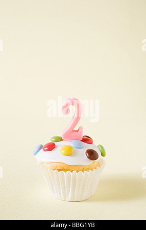 Cupcake with number two candle Stock Photo