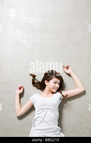 Young woman lying down Stock Photo