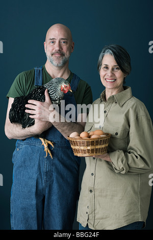 Couple with eggs and chicken Stock Photo