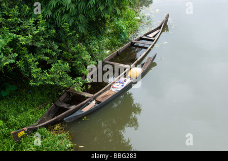 Old wooden country boat moored in backwaters of kerala india Stock Photo