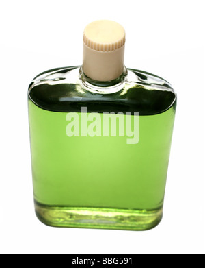 old bottle with green cologne isolated on white Stock Photo