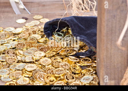 The pirate's sac of Gold doubloons Stock Photo