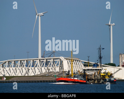 Ship steaming past the Maeslantkering moveable storm barrier near Rotterdam, the Netherlands Stock Photo