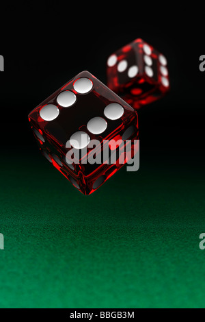 Gambling concept, two red casino dice in mid-air Stock Photo