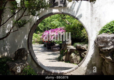 Moon gate or circular entrance into Humble Administrator s Garden Suzhou Jiansu China Stock Photo