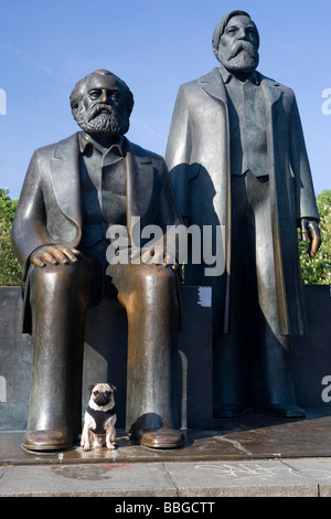 Young pug in front of Marx and Engels monument in Berlin, Mitte, Germany, Europe Stock Photo