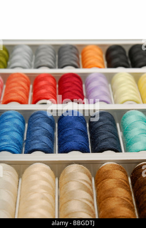 Spools of thread in various colours Stock Photo