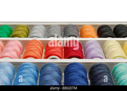 Spools of thread in various colours Stock Photo