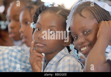 Group of beautiful black Haitian school children in blue school uniform ...