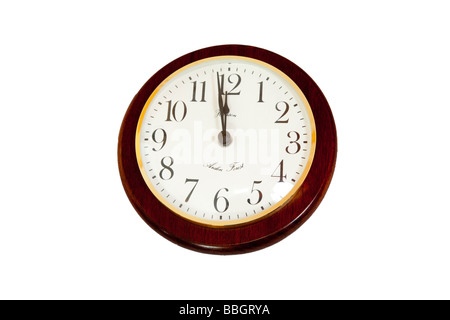 A clock showing one minute to twelve. Stock Photo