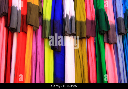Dyed fabrics for sale on a stall in the marketplace/souk at Rissani, Morroco Stock Photo