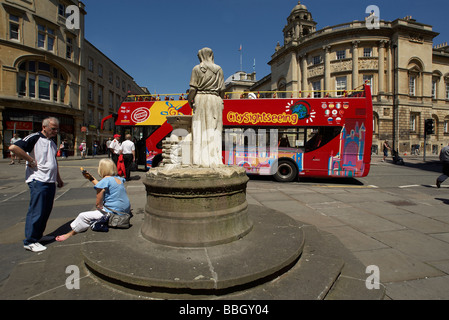 A tourist open top sightseeing tour bus in the historic city of Bath in Somerset England Stock Photo