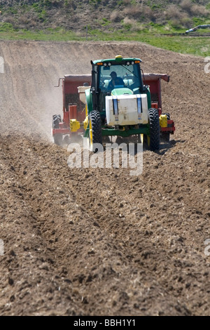 Farmer planting potato crop in Canyon County Idaho USA Stock Photo