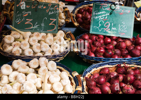 Garlic and Red Onions at a French Market in St Anns Square Manchester England Stock Photo