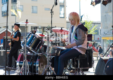Teenage rock band performing on stage on Main Square Joensuu Karelia Finland Stock Photo