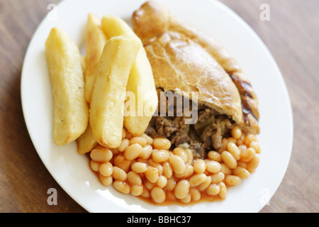 Authentic Cornish Pasty Filled With Meat and Vegetables with Chips and Baked Beans In Tomato Sauce With No People Stock Photo