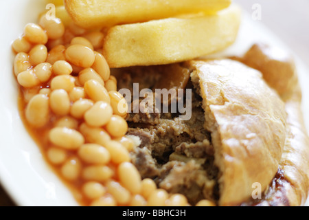 Authentic Cornish Pasty Filled With Meat and Vegetables with Chips and Baked Beans In Tomato Sauce With No People Stock Photo