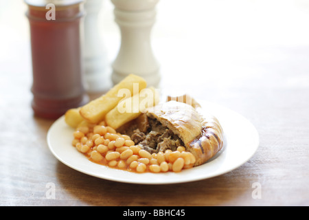 Authentic Cornish Pasty Filled With Meat and Vegetables with Chips and Baked Beans In Tomato Sauce With No People Stock Photo