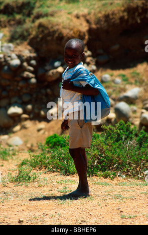 Zulu school boy is a beneficiary of a schools feeding scheme initiated by then president Nelson Mandela Unfortunately rampant Stock Photo