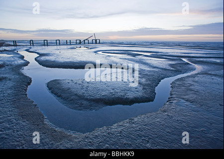 The Wash viewed from Snettisham RSPB Reserve Norfolk at dusk and at low tide in winter Stock Photo