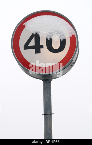 a forty mile and hour road speed limit covered in snow Stock Photo