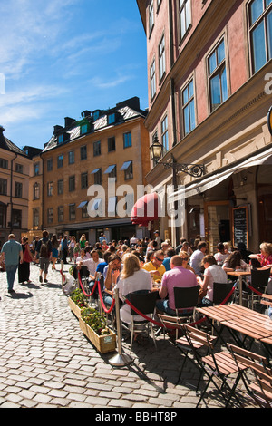 People eating lunch at one of many vintage restaurants and cafes around Järntorget in Gamla Stan the Old Town of Stockholm Stock Photo