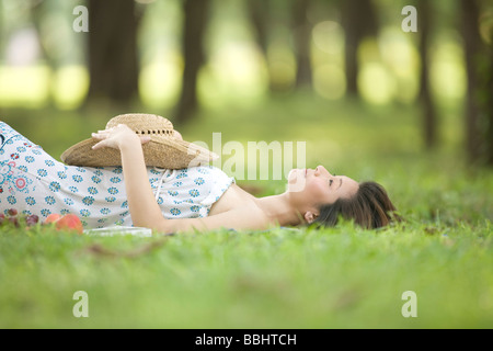Young woman relaxing in a park Stock Photo